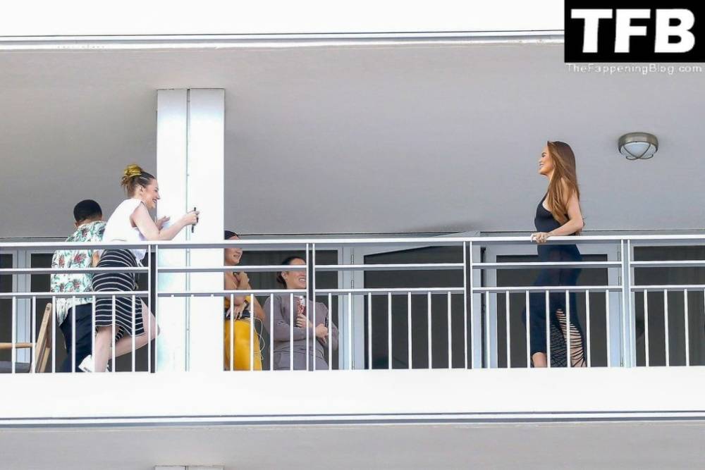 Chrissy Teigen & John Legend Kiss and Pose During an Impromptu Balcony Shoot - #25
