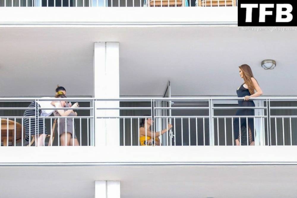 Chrissy Teigen & John Legend Kiss and Pose During an Impromptu Balcony Shoot - #27