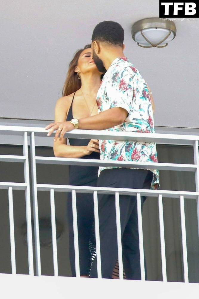 Chrissy Teigen & John Legend Kiss and Pose During an Impromptu Balcony Shoot - #26