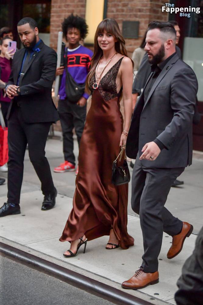 Dakota Johnson Stuns in a Copper Silk Gown Leaving Her Hotel in NYC (29 Photos) - #24