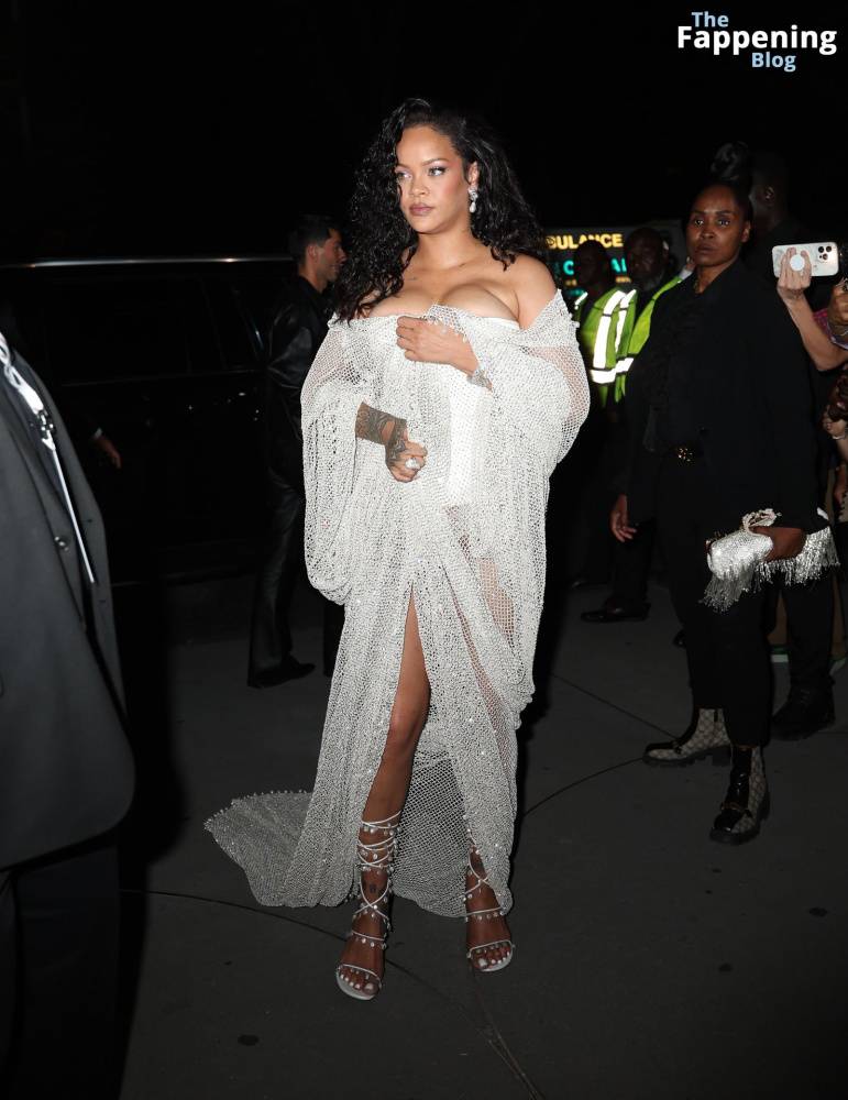 Rihanna Displays Her Curves in a White Dress (13 Photos) - #1