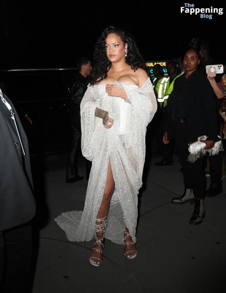 Rihanna Displays Her Curves in a White Dress (13 Photos) on fansphoto.pics